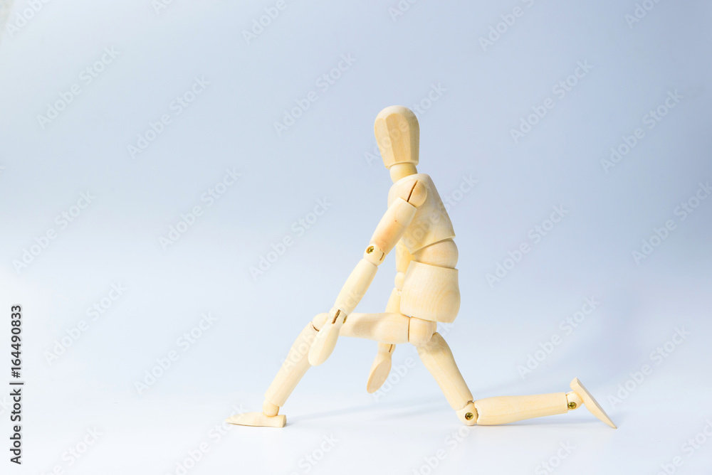 Wooden figure doll with prepare to run emotion for start up business concept on white background Wooden figure doll with prepare to run emotion for start up business concept on white background