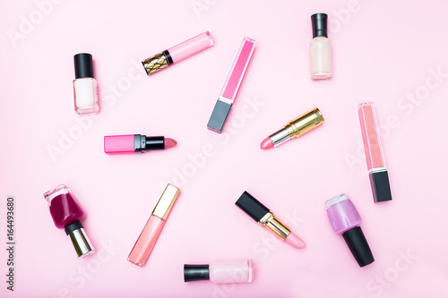 Female cosmetics on a pink background. View from above