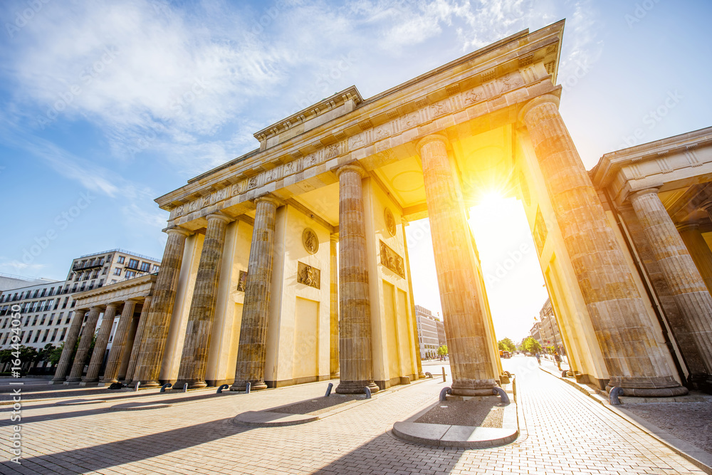 View on the famous Brandenburg gates on the Pariser square during the sunrise in Berlin city