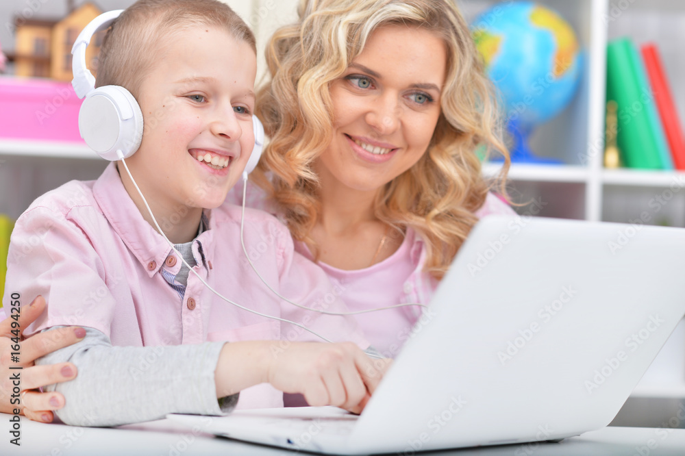 Mother and son using laptop Mother and son using laptop