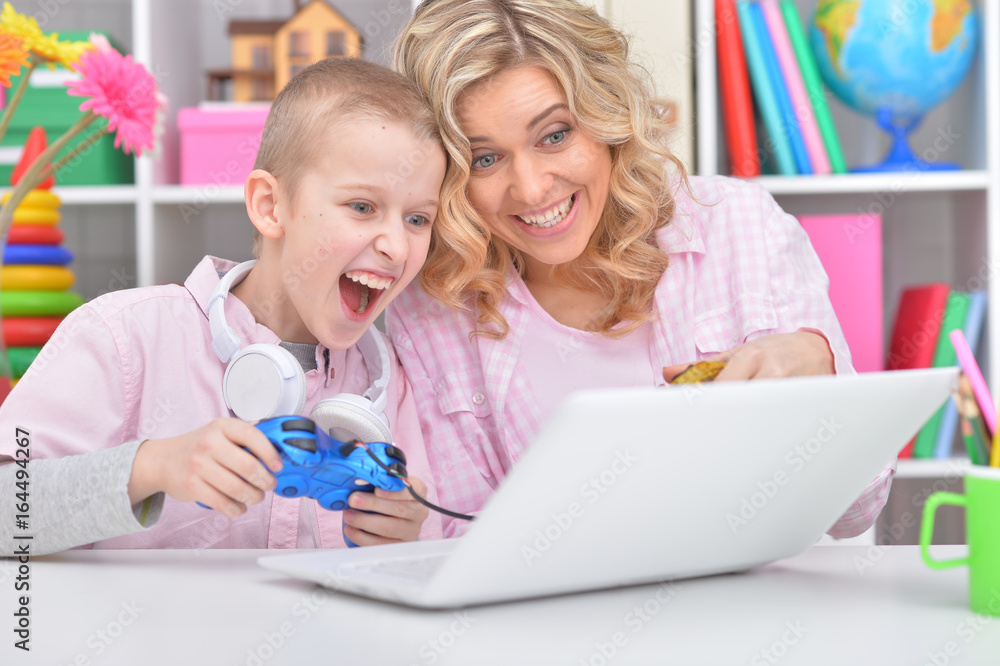 Mother and son playing game Mother and son playing game