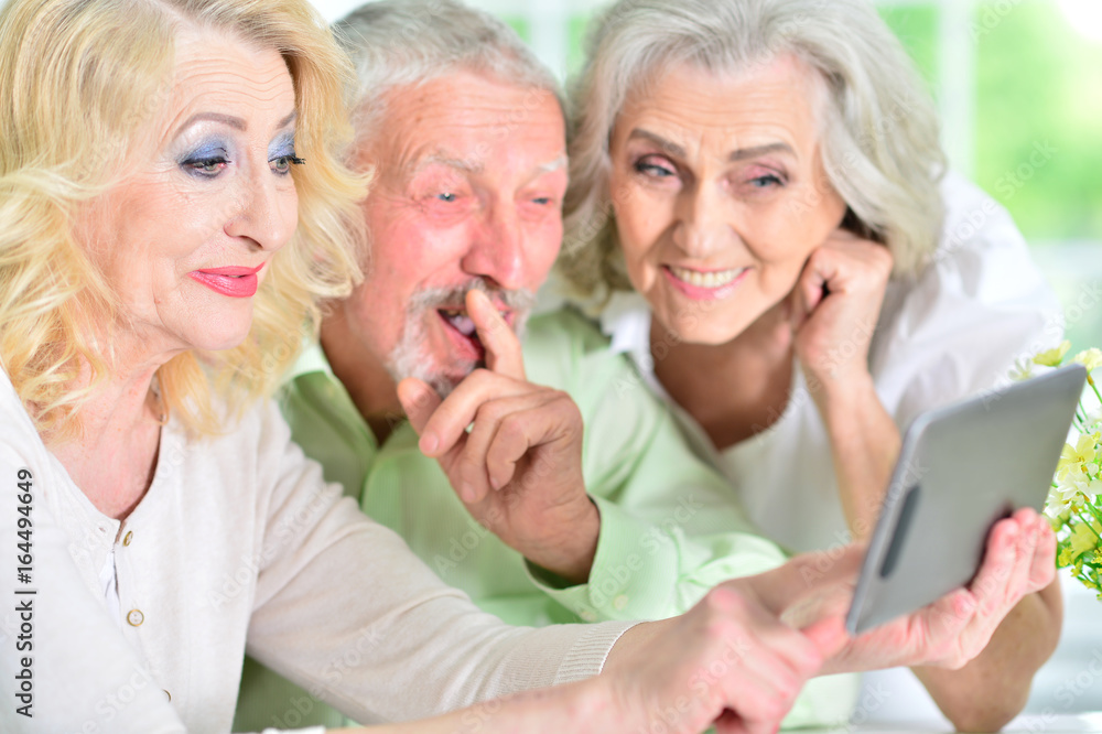 senior people using digital tablet senior people using digital tablet