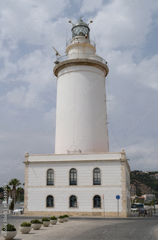 MALAGA, ANDALUCIA/SPAIN - JULY 5 : Lighthouse in the Harbour Area of Malaga Costa del Sol Spain on July 5, 2017 MALAGA, ANDALUCIA/SPAIN - JULY 5 : Lighthouse in the Harbour Area of Malaga Costa del Sol Spain on July 5, 2017