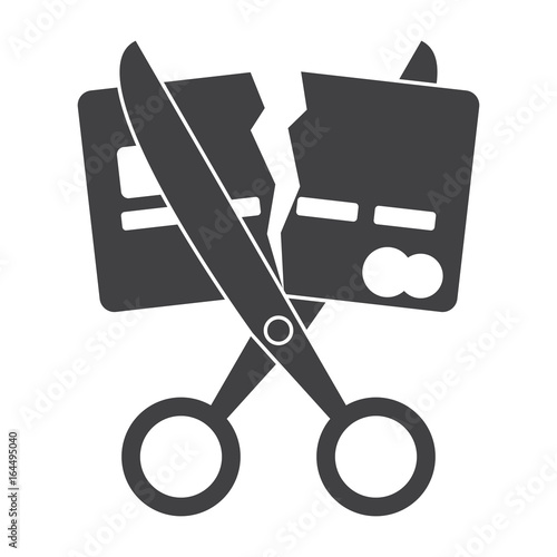 Debt free concept with scissors and broken credit card