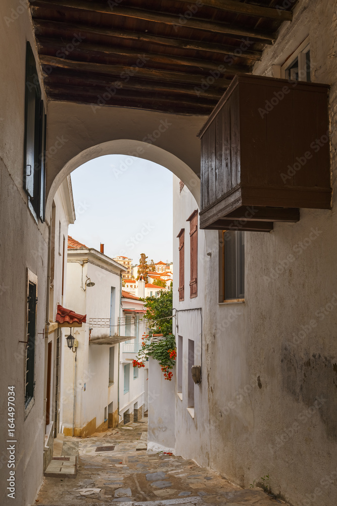 Fototapeta premium Street in the old town of Skopelos, Greece. 
