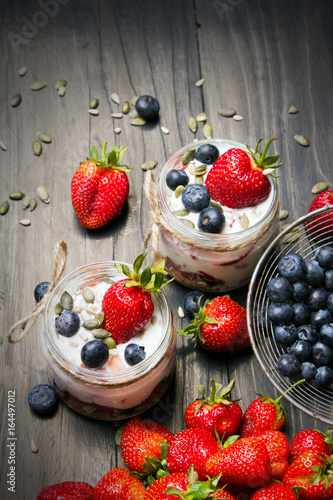 delicious dessert - yogurt with strawberries and blueberries