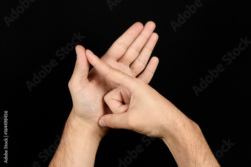 The language of the deaf English version of the gesture the letter A photo