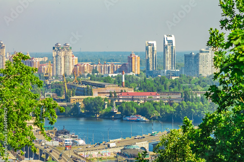 Panorama of a large modern city with houses and a river. View from the height