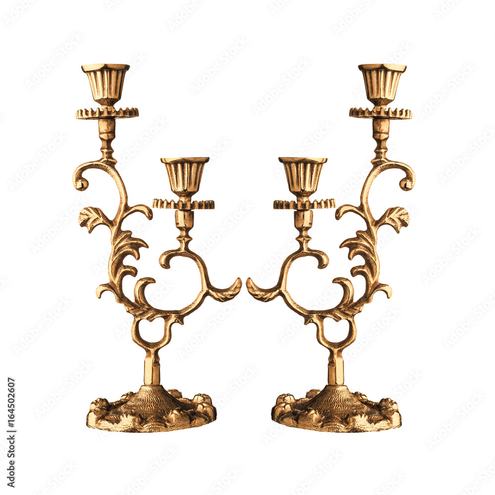 photo of golden bronze jewish candlestick on white background photo of golden bronze jewish candlestick on white background