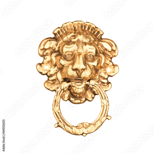 Old medieval bronze door knocker in shape of lion head isolated on white background