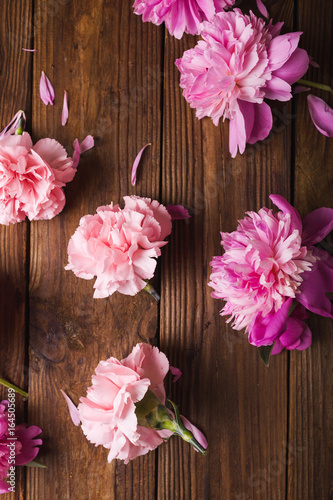 Peonies. Pink peonies on a wooden background. Copyspace. Flower photo concept © avdeyukphoto