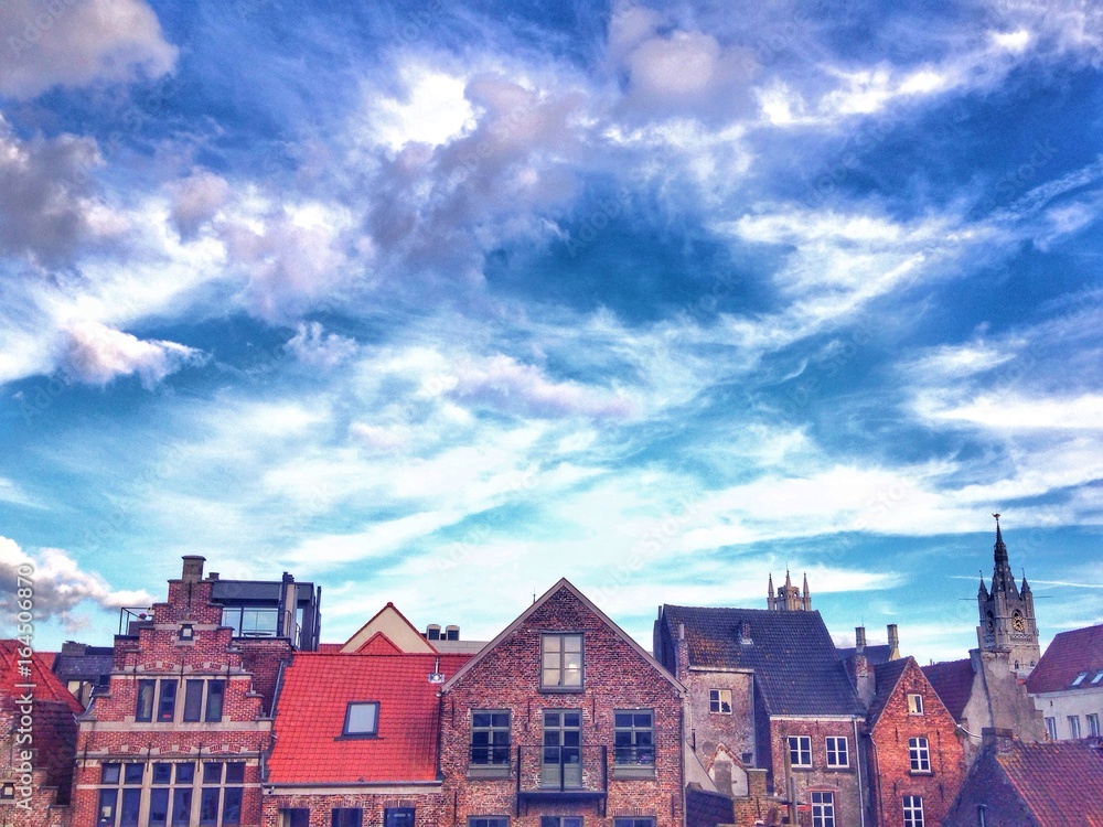 Rooftops of the old town in Ghent, Belgium against dramatic sky