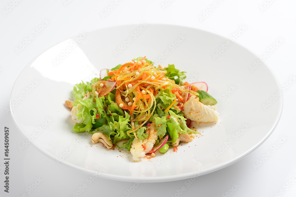 Warm salad with squid, vegetables with grape sauce. White background, menu concept. Warm salad with squid, vegetables with grape sauce. White background, menu concept.