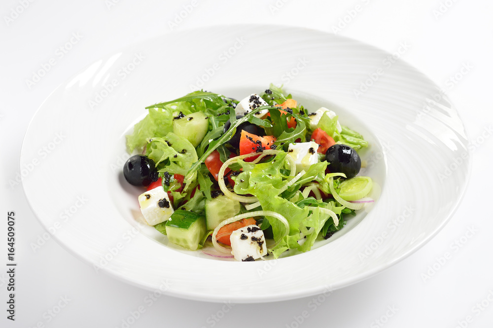 Fresh Greek salad, white background Fresh Greek salad, white background