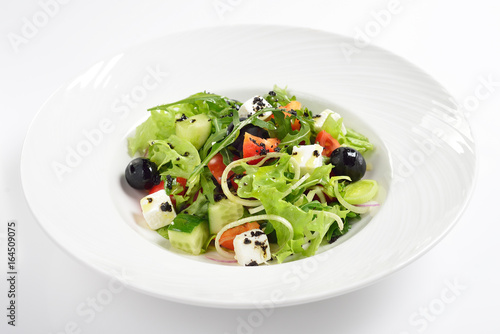 Fresh Greek salad, white background