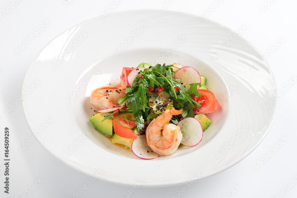 Creative salad with tiger shrimps, tomatoes, avocado and arugula. Creative salad with tiger shrimps, tomatoes, avocado and arugula.