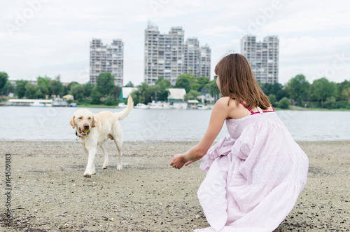 female and dog having fun on vacation