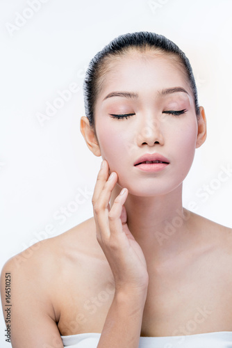 young beautyful asian woman make up on white background