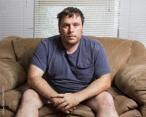 man sitting on the couch