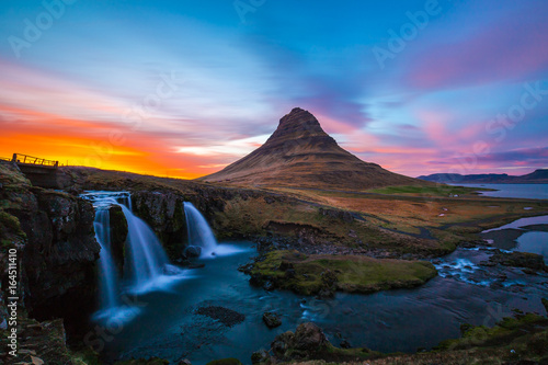 Kirkjufell Church mountain at sunset with pink and orange skyline, Iceland