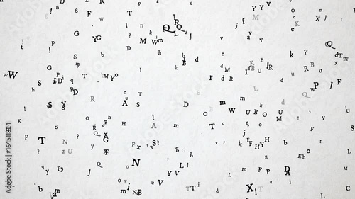 Old sytle letters / characters flying over old white paper. High quality animation.  Seamless loop, 1080p, 30fps photo