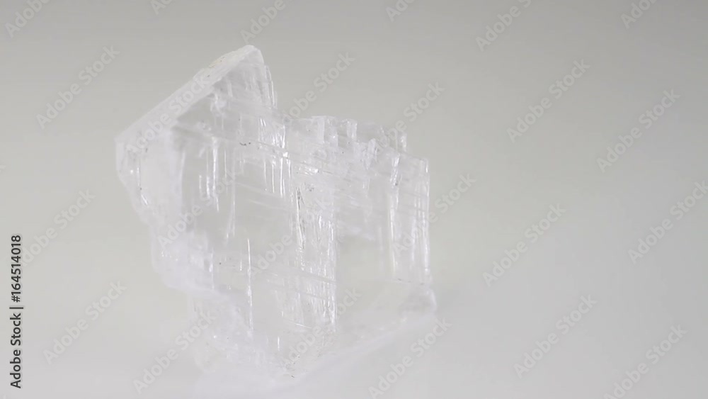 Selenite, crystalline mineral stone isolated on a white background Selenite, crystalline mineral stone isolated on a white background