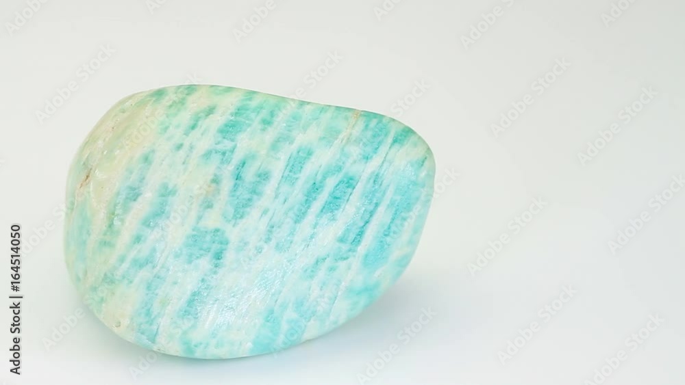 Amazonite or Amazon stone, green mineral isolated on a white background Amazonite or Amazon stone, green mineral isolated on a white background