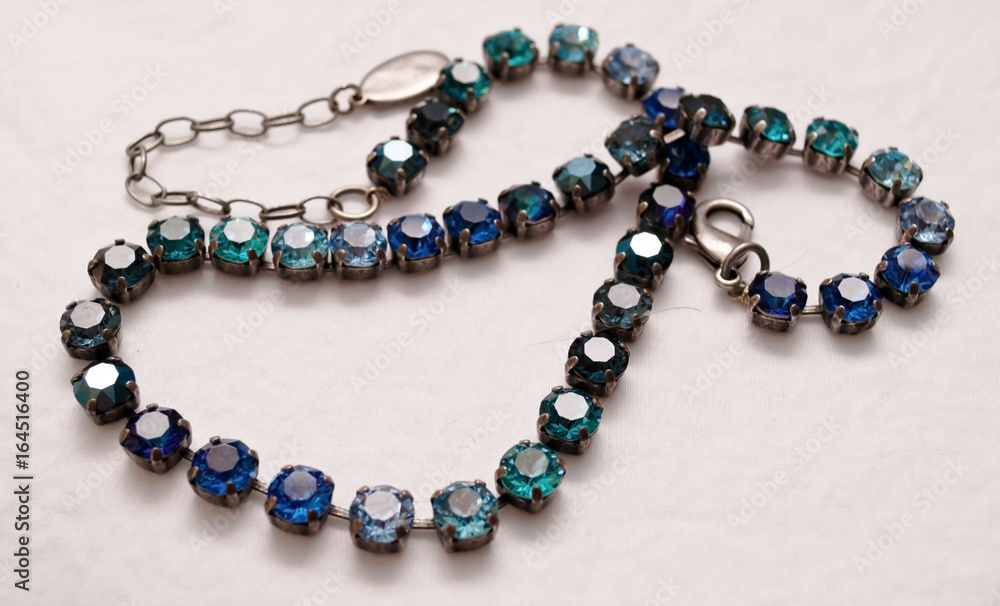 A beautiful blue and silver necklace with a white background A beautiful blue and silver necklace with a white background