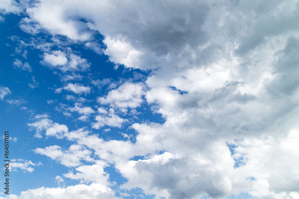 A bright blue background of sky and clouds A bright blue background of sky and clouds