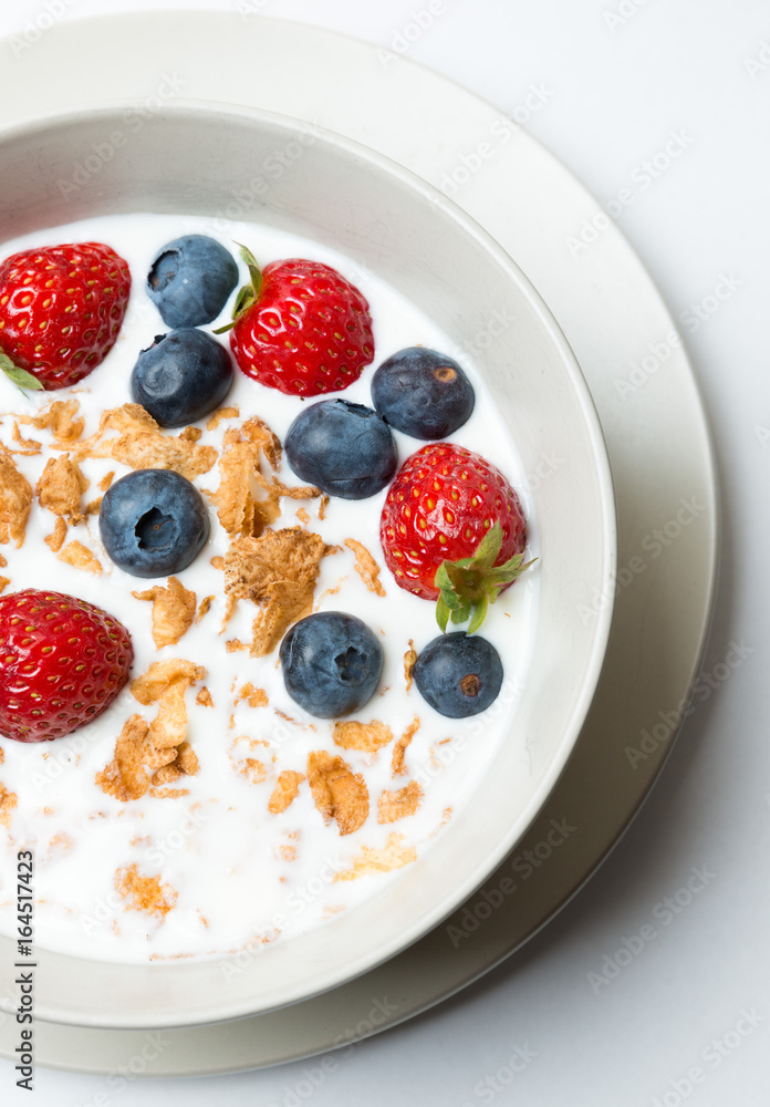 Cereal bowl with fruit healhy breakfast isolated on white Cereal bowl with fruit healhy breakfast isolated on white