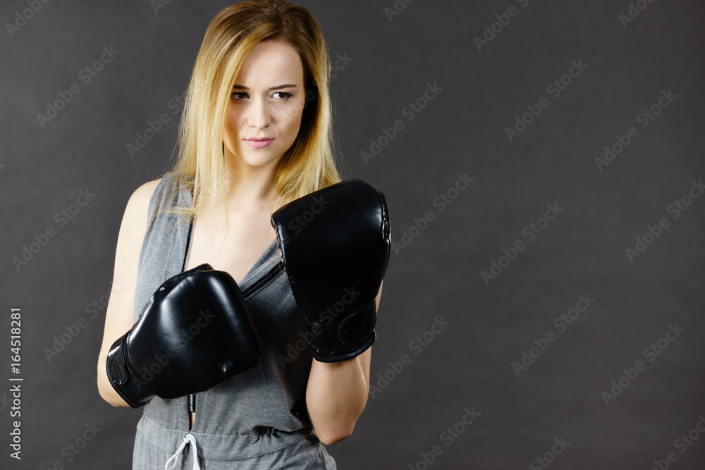 Boxer girl exercise with boxing gloves.