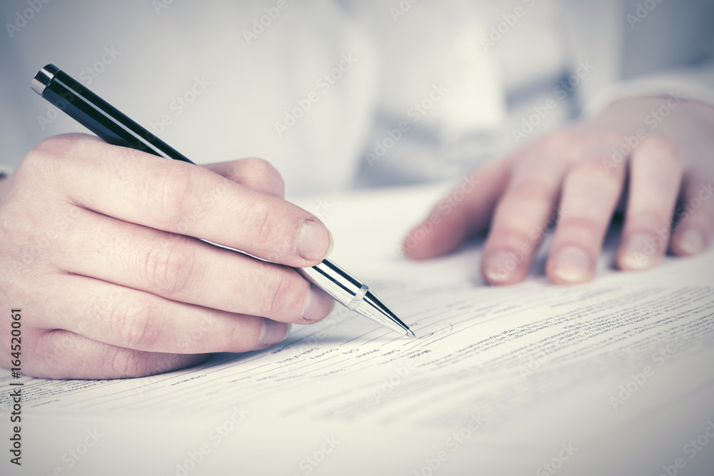 Business woman signing contract Business woman signing contract