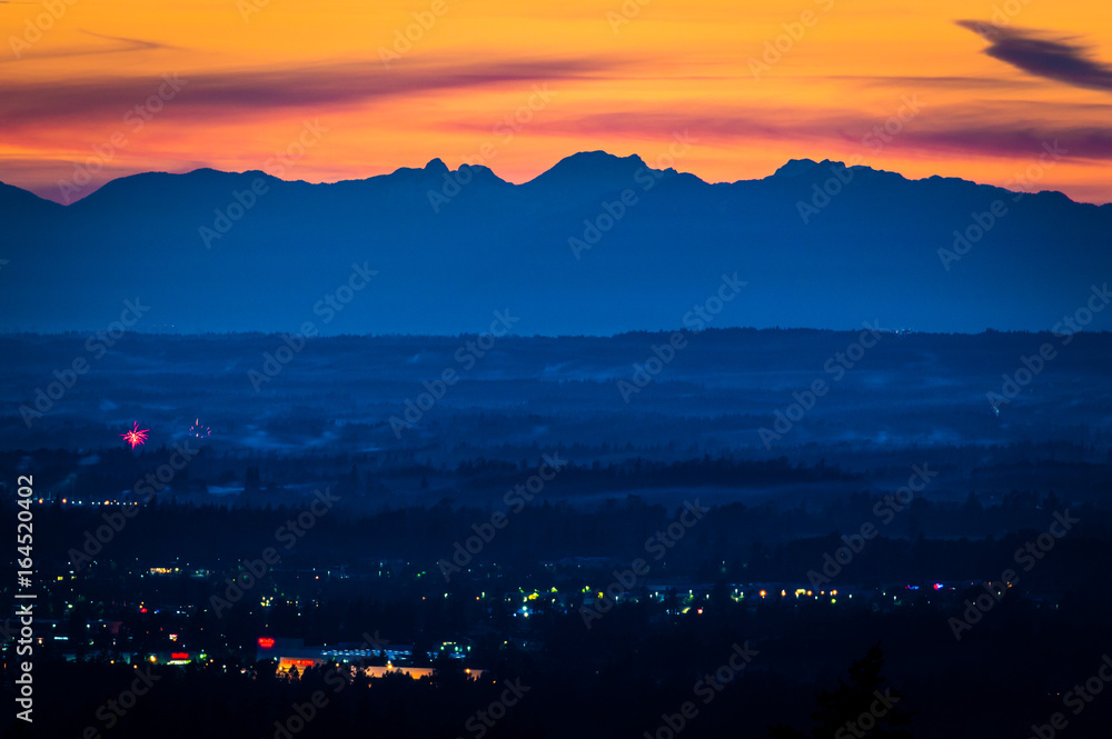 View of the Canadian Rockies and Bellingham at sunset 