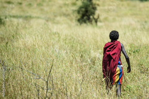 Young Masai boy on savannah