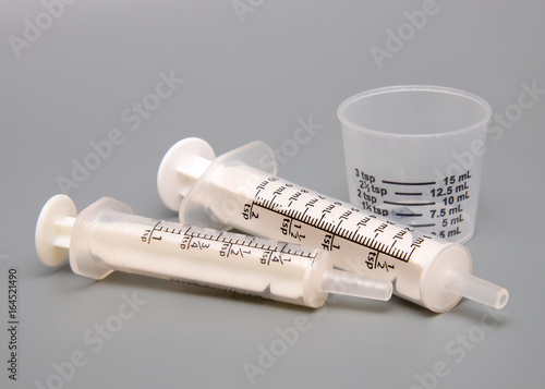 Oral medicine syringes and medicing dosing cup