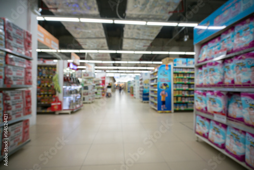 Supermarket blurred background with colorful shelves and unrecognizable customers © Hanoi Photography