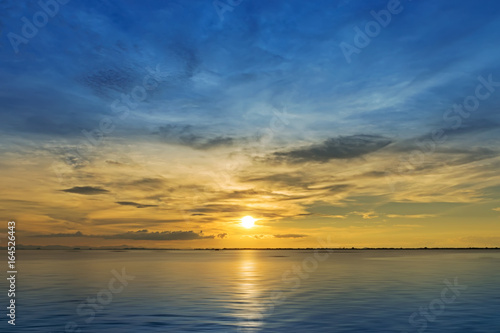 Beautiful sunset in the sea. © noppharat