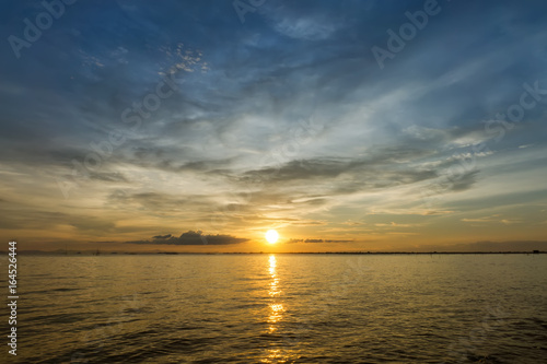 Beautiful sunset in the sea. © noppharat