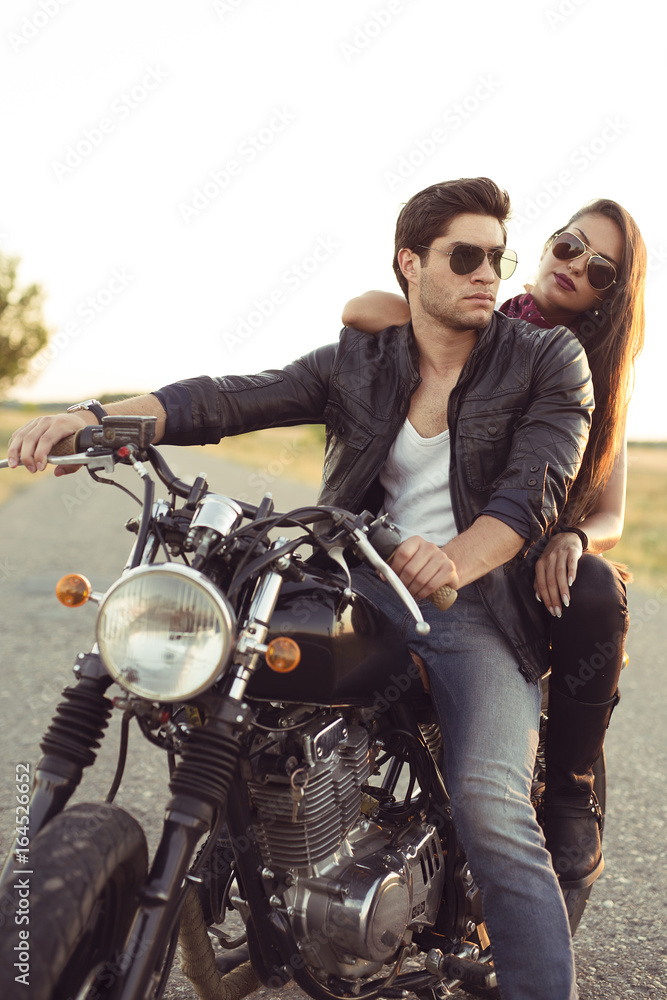 Sexy couple of bikers on the vintage custom motorcycle Stock Photo ...