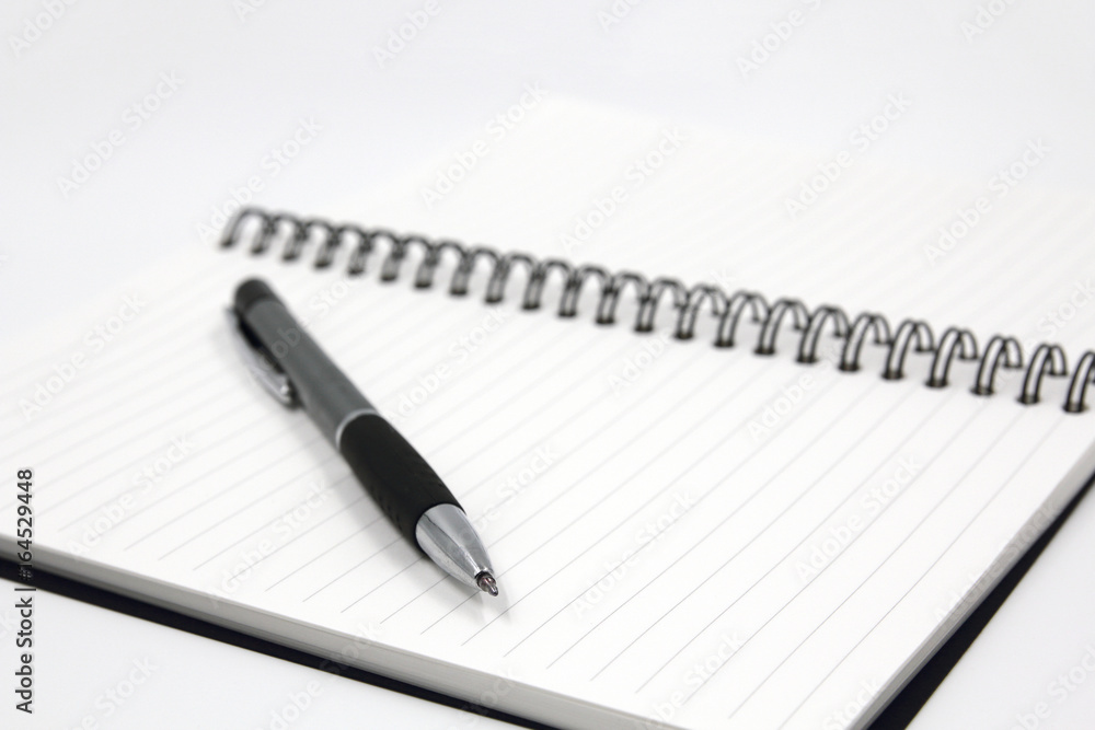 Notebook and pen isolated on white background Notebook and pen isolated on white background