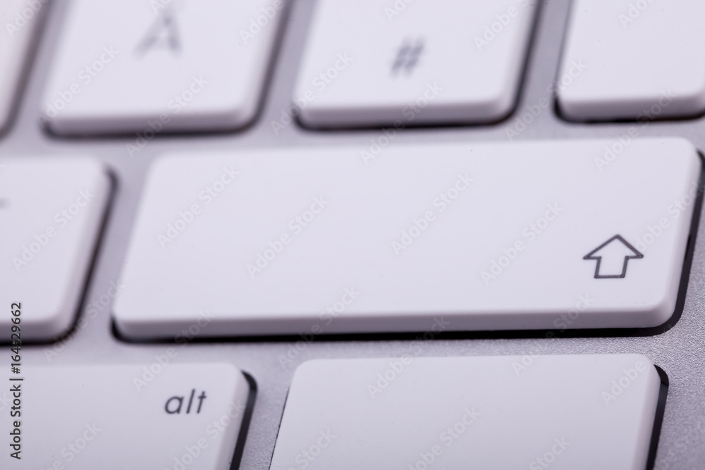 White aluminum keyboard in close up. Technology and communication