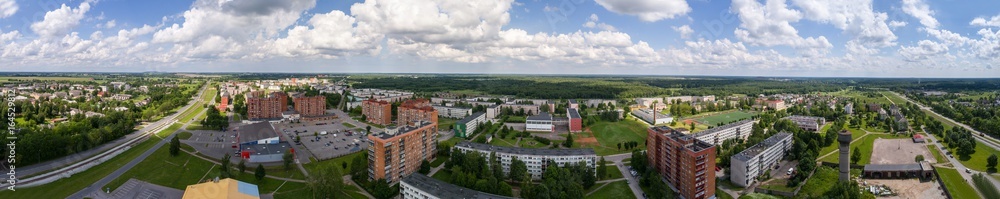 Panorama. Aerial photography. Small city landscape, amazing clouds.