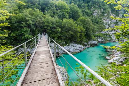 Bild auf Leinwand Wooden Bridge over rover Soca, Slovenia