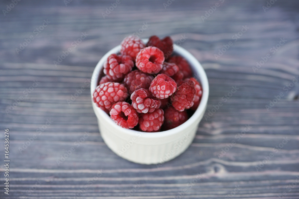 Frozen berry raspberry with white hoarfrost Frozen berry raspberry with white hoarfrost
