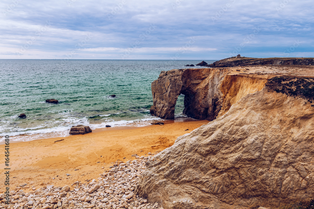 Spectacular natural cliffs and stone arch Arche de Port Blanc and