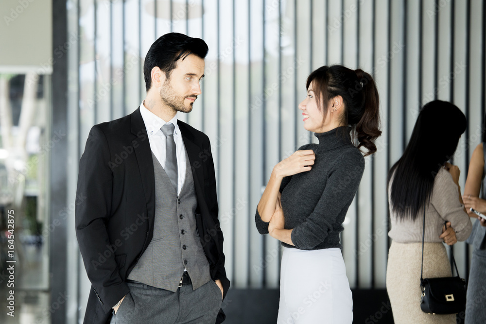 Asian women working together with attractive smiling at office place, women working concept, vintage tone. Asian women working together with attractive smiling at office place, women working concept, vintage tone.