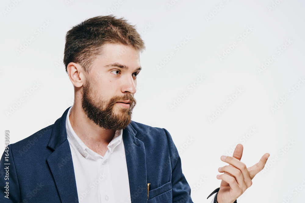 Business man with a beard on a white isolated background shows on an empty space Business man with a beard on a white isolated background shows on an empty space