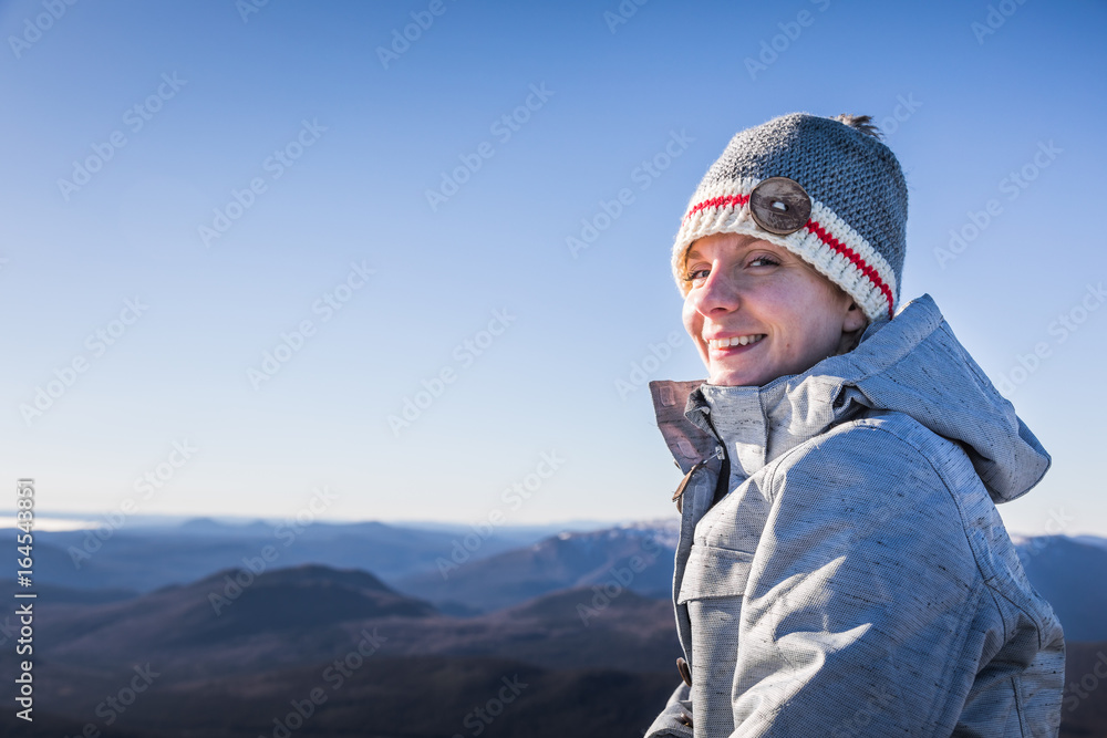 Happy Woman Enjoying the View of the Richardson Mountain's Summit Happy Woman Enjoying the View of the Richardson Mountain's Summit