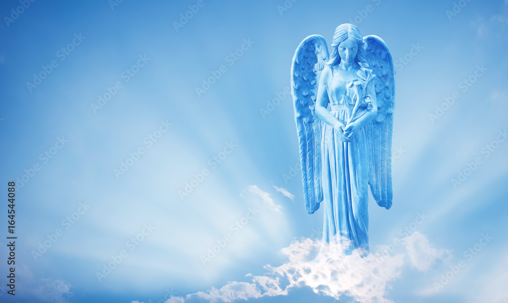 Beautiful angel in heaven with divine rays of sun light Stock Photo