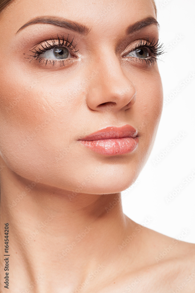 Beautiful model with natural make-up on white background. Studio photo Beautiful model with natural make-up on white background. Studio photo